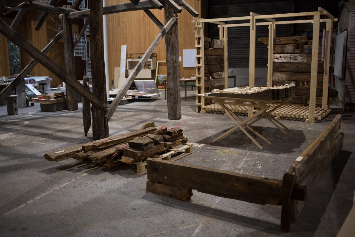 four elements placed at mini exhibition at BAS. (pile of wood from old log house, a corner from old log house, 1:500 model of Sandviken, 1:1 model showing one design structural logic.