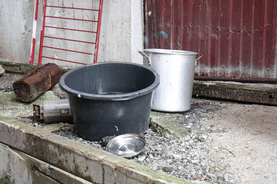 Before there was a water container elevated from the ground there was a bucket